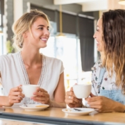 two women talking in coffee shop