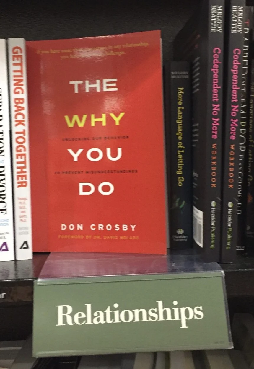 The Why You Do by Don Crosby on a bookstore shelf in the Relationships section
